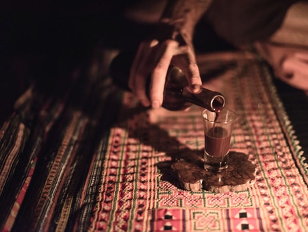 pouring ayahuasca during Ayahuasca ceremony at Caya Shobo